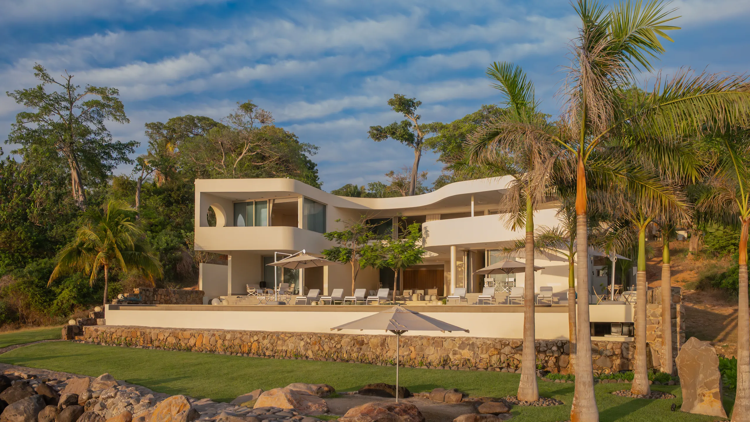 Contemporary oceanfront architecture positioned directly along the coastline of Marina Chacala, designed to maximize privacy, light, and uninterrupted Pacific views.