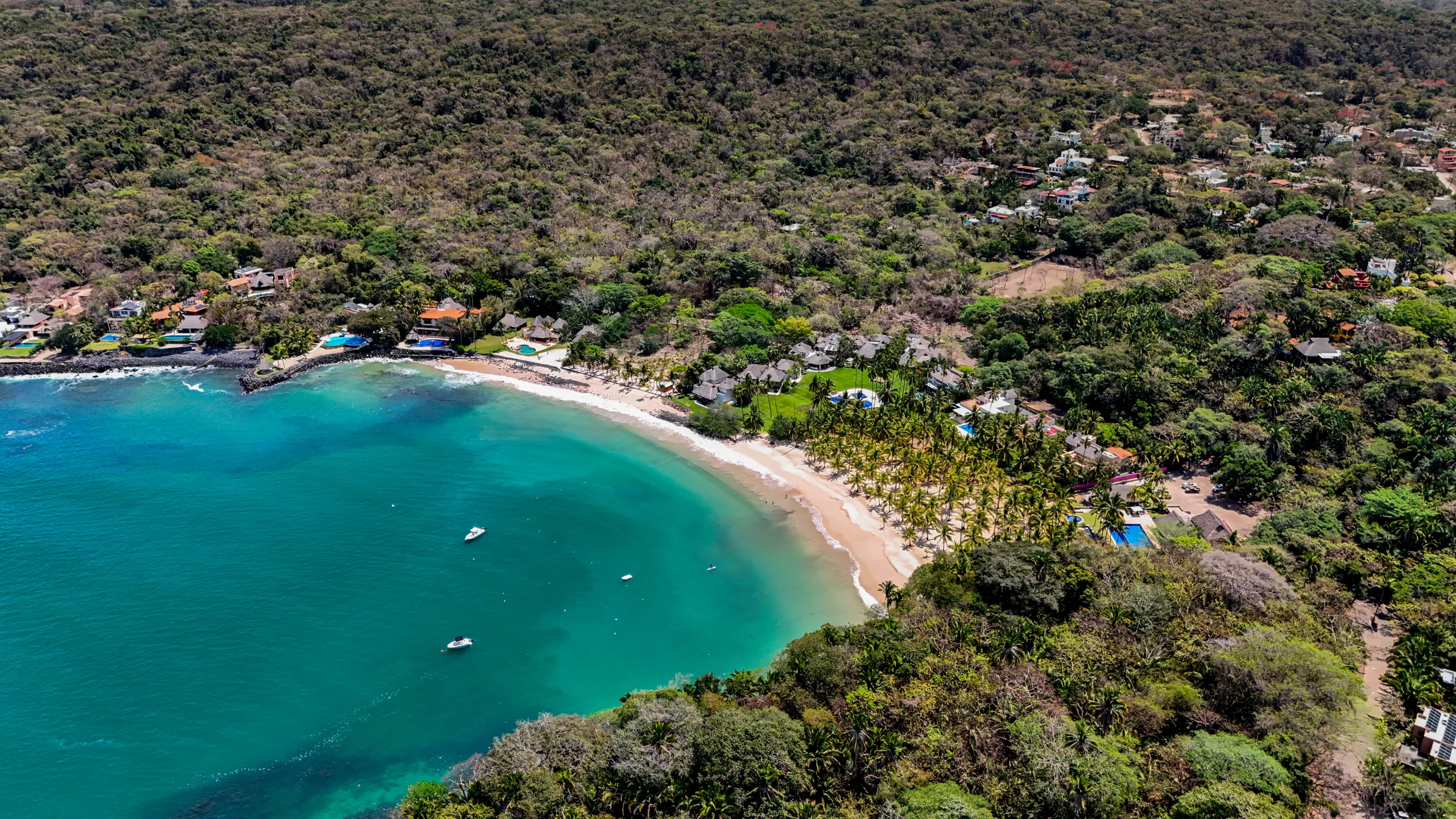 Aerial perspective of Marina Chacala’s protected bay, recognized for its natural beauty, calm waters, and low-density coastal environment.