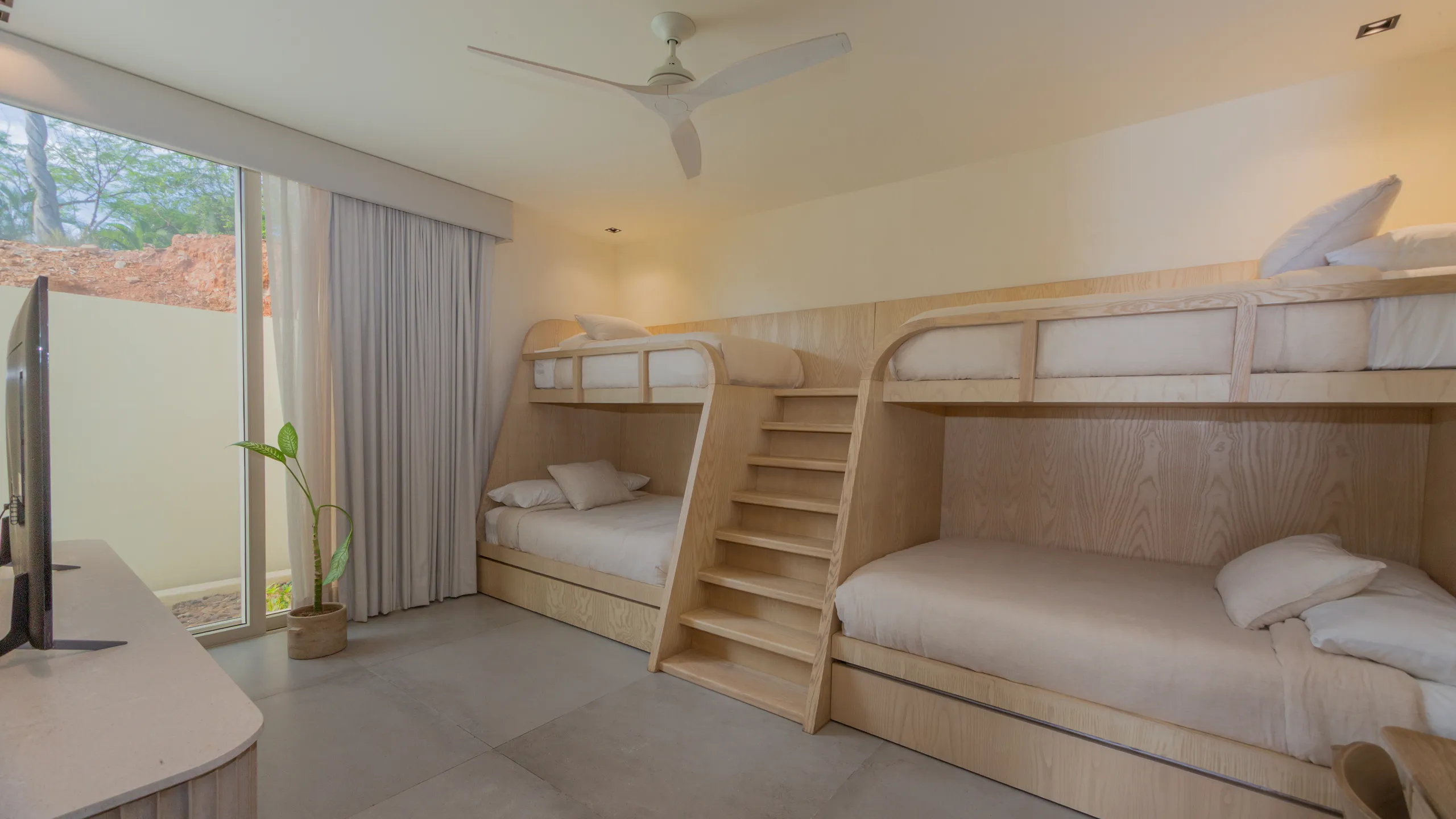 Custom-designed bunk room offering functional luxury accommodations ideal for family living and multi-generational stays.