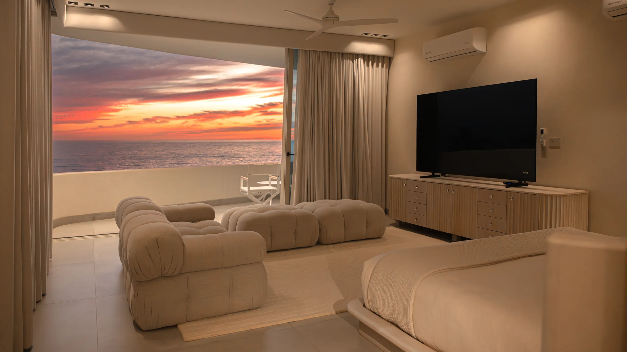 Oceanfront bedroom suite offering uninterrupted sunset views and direct connection to the Pacific horizon.